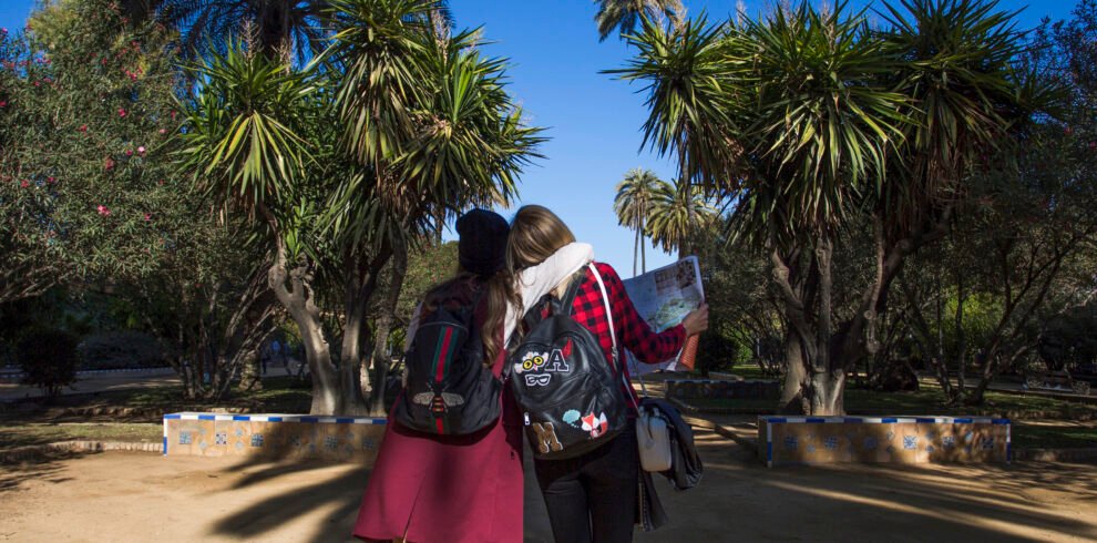hugging-women-walking-park