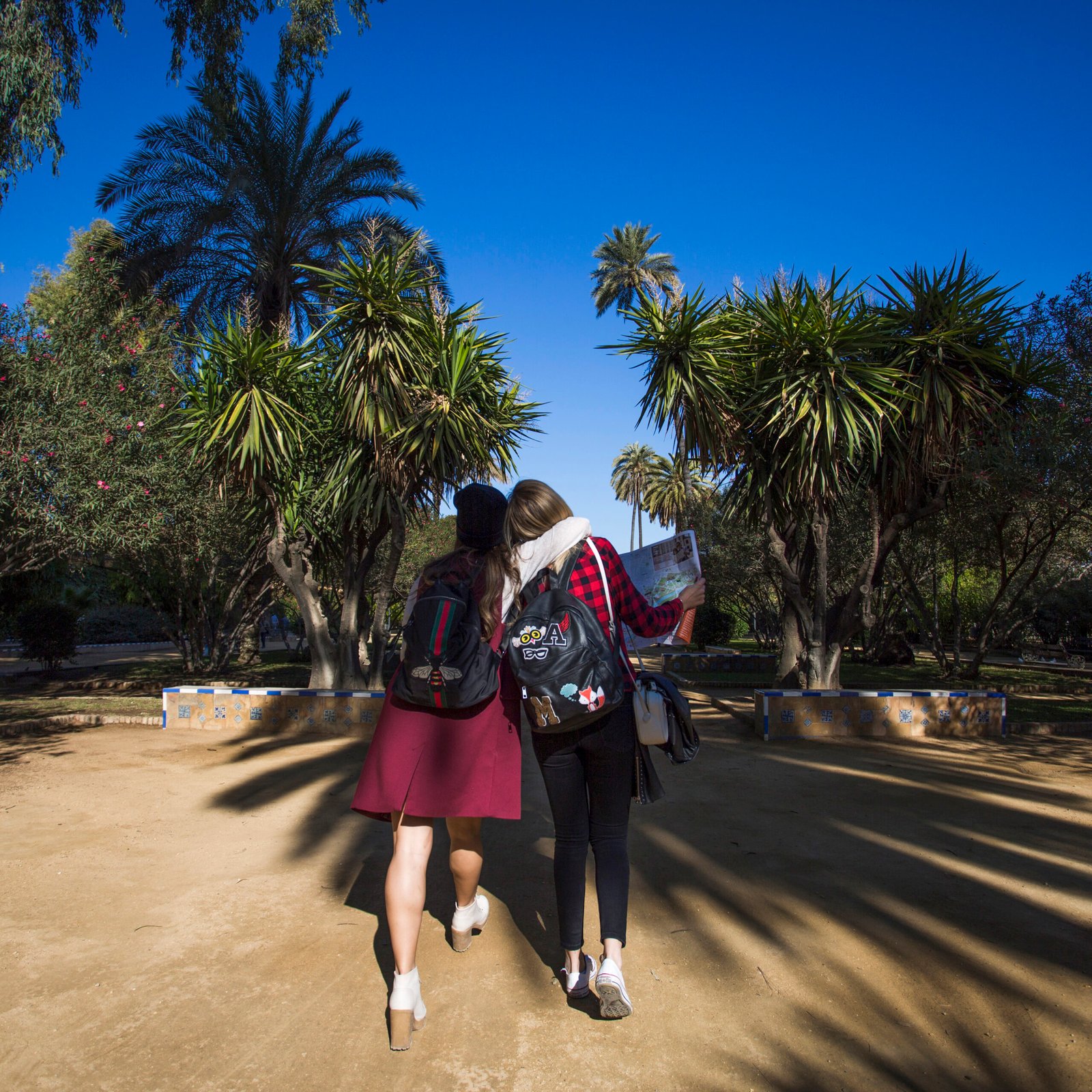 hugging-women-walking-park